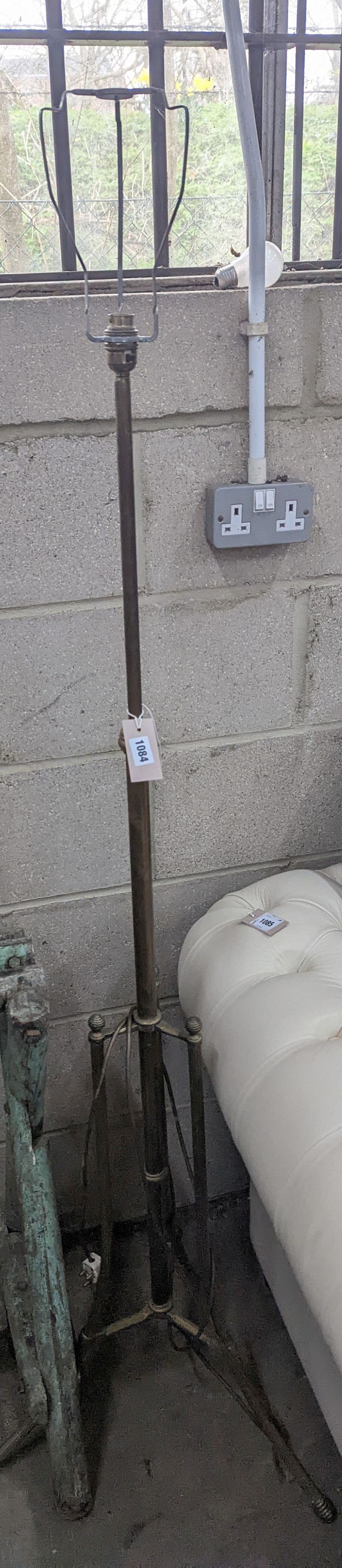 An early 20th century brass telescopic standard lamp